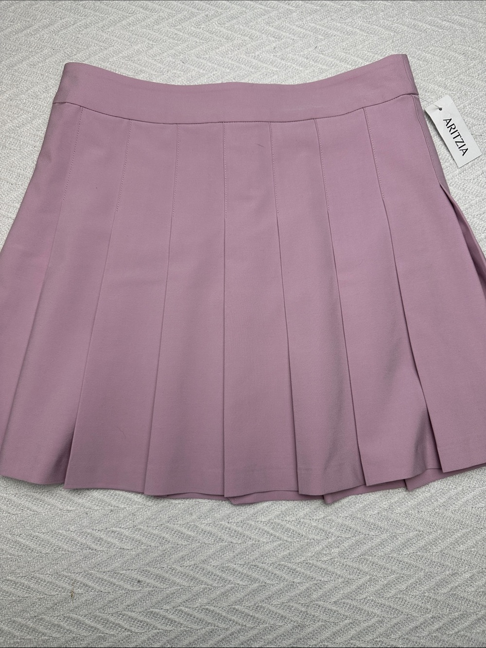 Sunday Best Pleated Skater Mini Skirt in Lavender Pink Aritzia